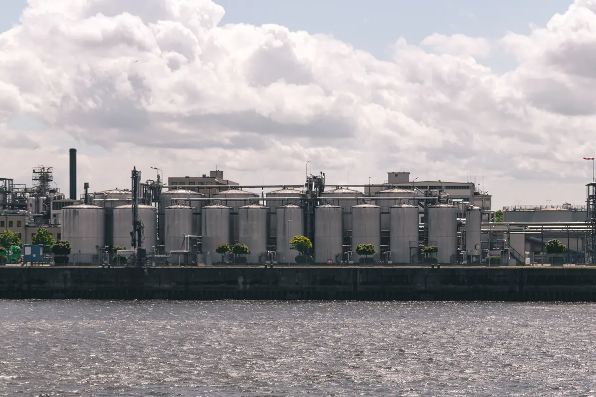 Industrial water and utilities facility beside a waterway